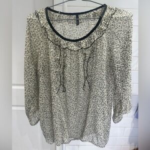 NAF NAF Paris Blouse– Size 40
Sheer | Ruffle Detail | Black & White Abstract